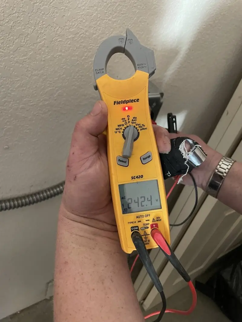 Voltage testing with clamp meter during Whole House Surge Protector in Lake Goodwin